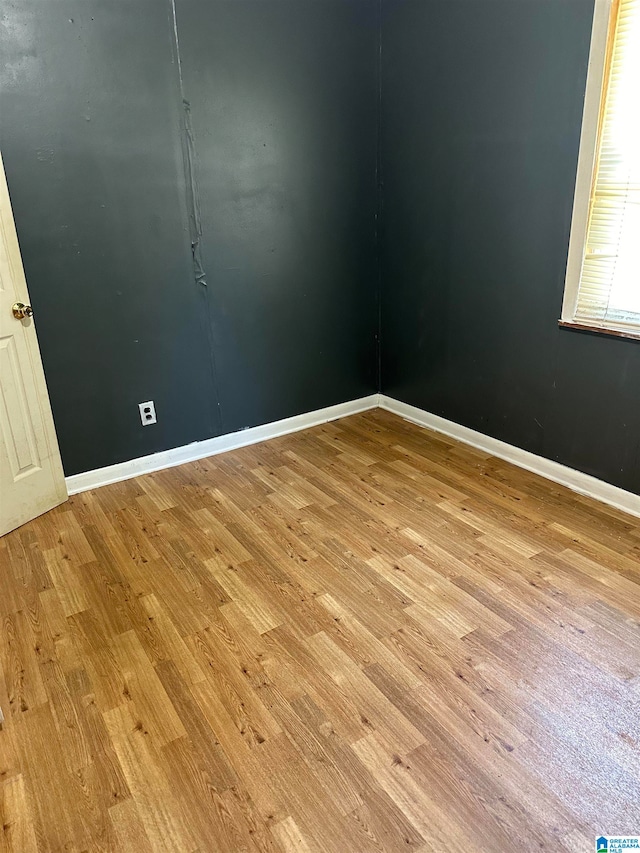 empty room with light hardwood / wood-style floors