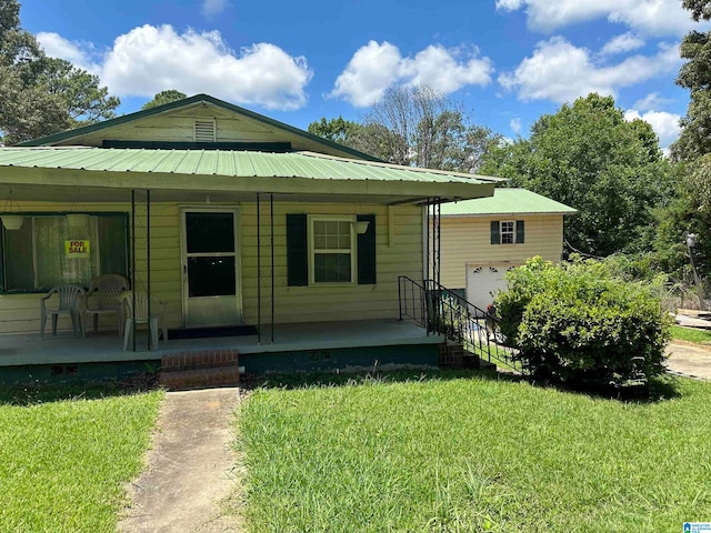 view of front of home with a front lawn and a porch