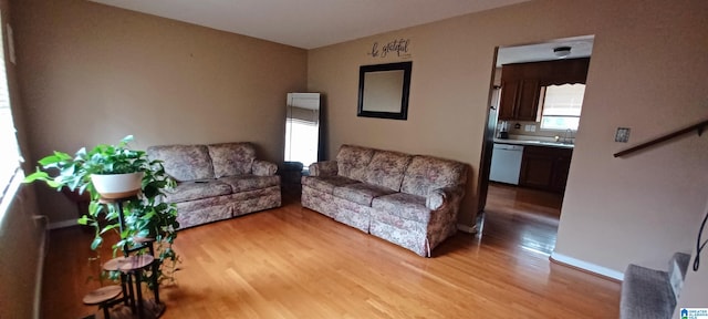 living room with light hardwood / wood-style floors