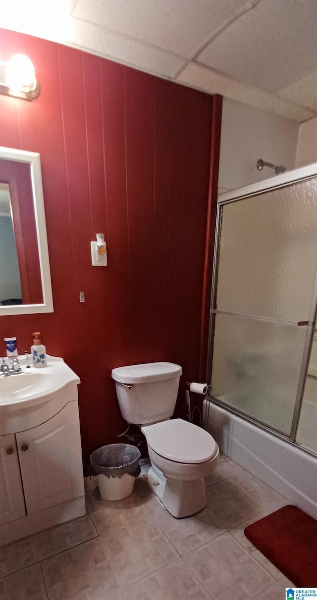 full bathroom with vanity, enclosed tub / shower combo, and toilet