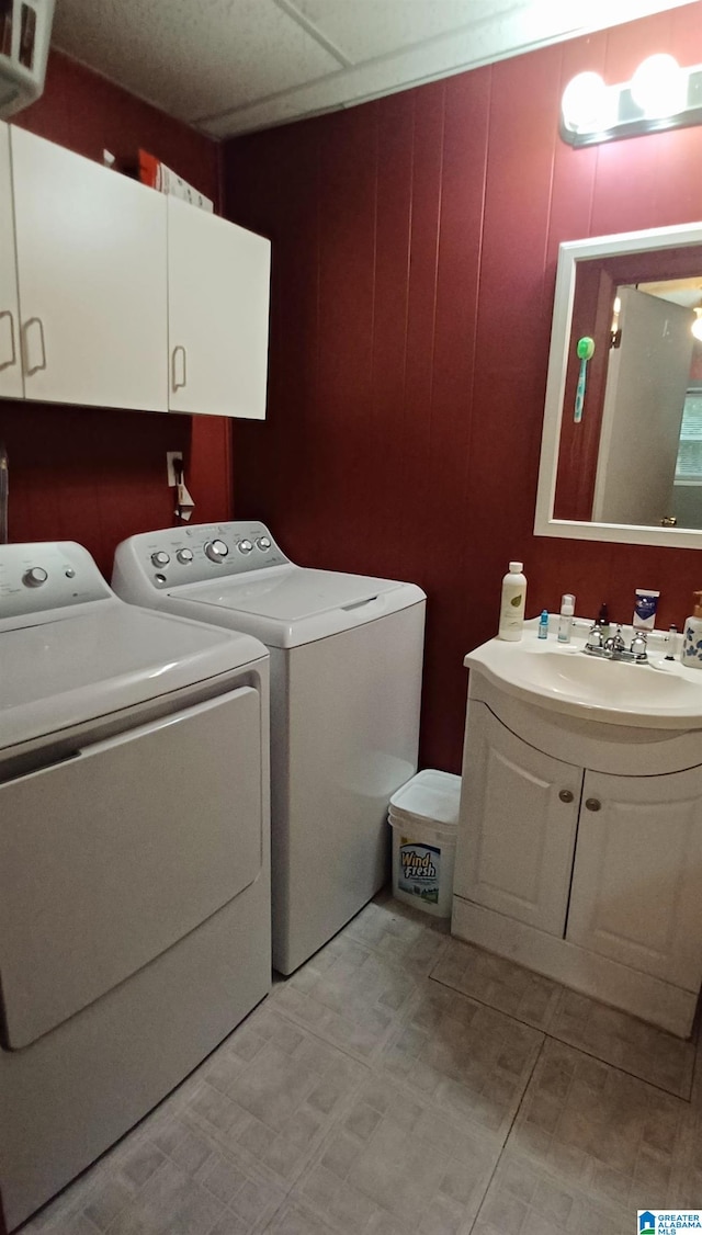 laundry area with cabinets and washing machine and dryer