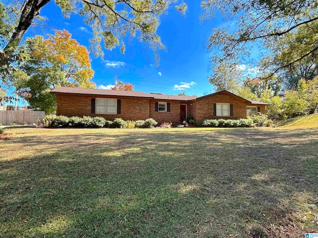 single story home featuring a front yard