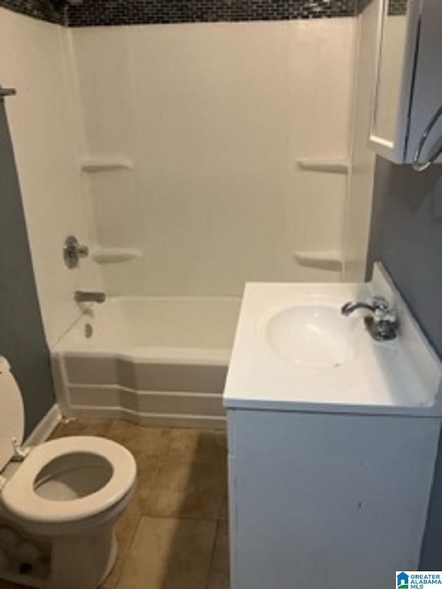 full bathroom with toilet, shower / washtub combination, vanity, and tile patterned flooring