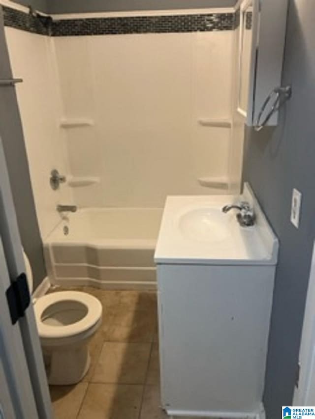 full bathroom featuring toilet, shower / tub combination, vanity, and tile patterned floors