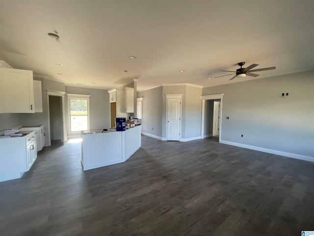 kitchen with ceiling fan, dark wood-type flooring, and white cabinetry