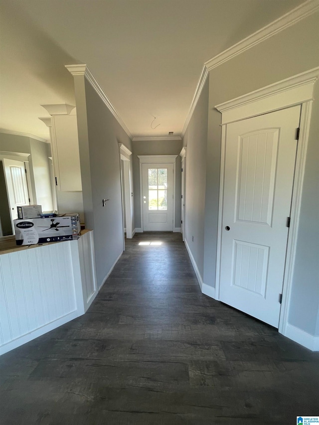 corridor featuring dark hardwood / wood-style flooring and ornamental molding