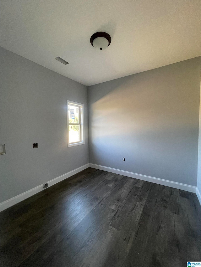 unfurnished room featuring dark hardwood / wood-style floors