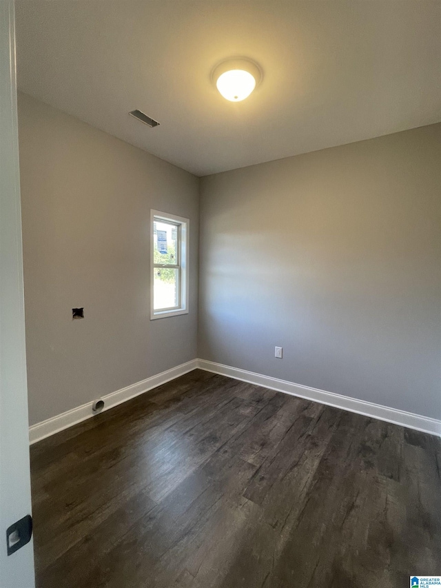 unfurnished room with dark hardwood / wood-style floors