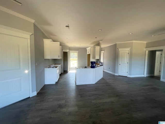 kitchen featuring white cabinetry and ornamental molding