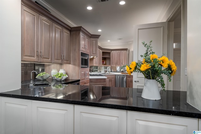 kitchen featuring kitchen peninsula, dishwasher, sink, and crown molding