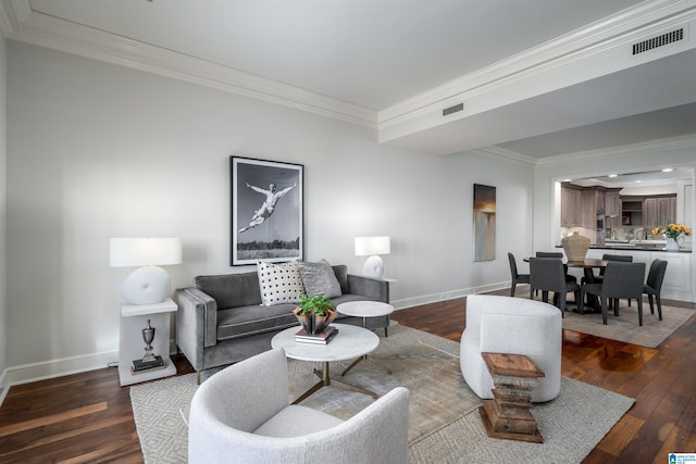 living room featuring crown molding and dark hardwood / wood-style flooring