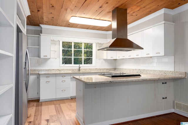 kitchen with stainless steel refrigerator with ice dispenser, range hood, light stone countertops, white cabinets, and light hardwood / wood-style floors