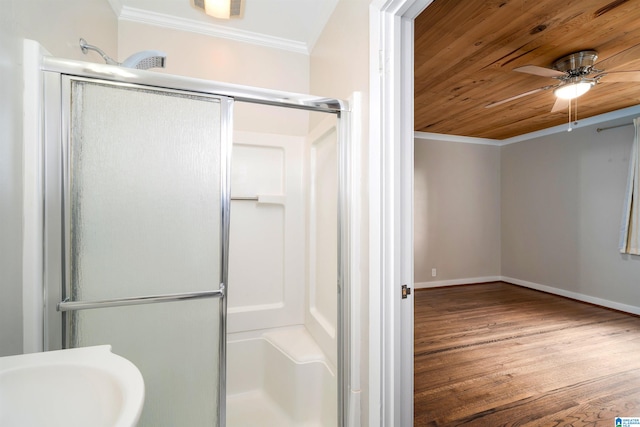 bathroom with wood ceiling, a shower with shower door, wood-type flooring, sink, and crown molding