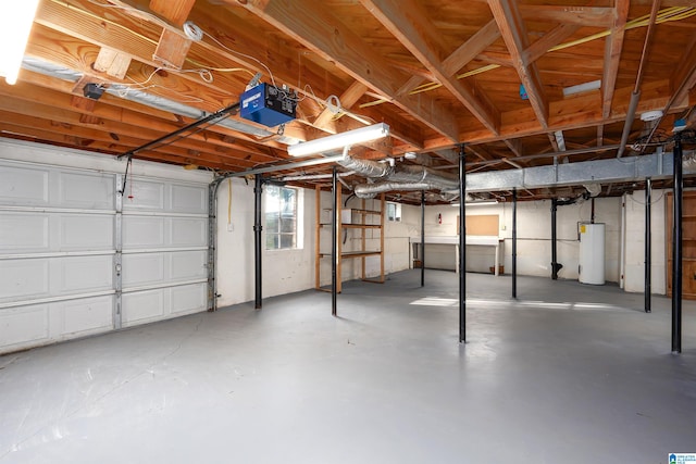 garage featuring water heater and a garage door opener