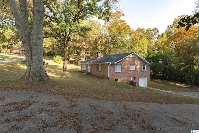 view of side of property with a garage