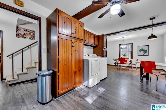 laundry room with ceiling fan, washing machine and dryer, cabinets, and hardwood / wood-style floors