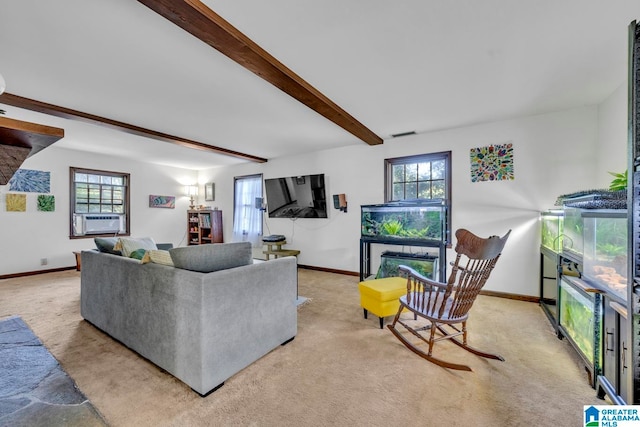 carpeted living room featuring cooling unit, beamed ceiling, and a wealth of natural light