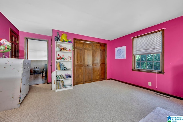 unfurnished bedroom featuring a closet and carpet