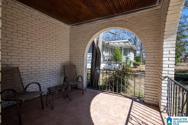 view of patio featuring a balcony