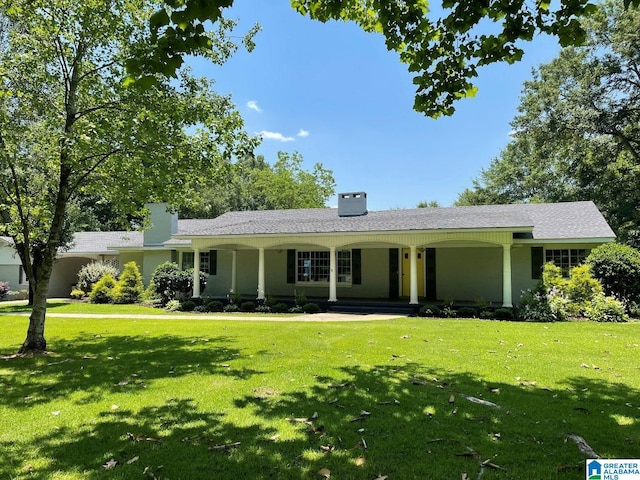 765 2nd Ave, Ashland, AL 36251 - single story home featuring a front yard, covered porch, and a chimney