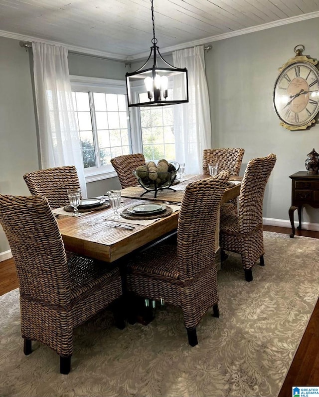 765 2nd Ave, Ashland, AL 36251 - dining area with a chandelier, ornamental molding, wood finished floors, and baseboards