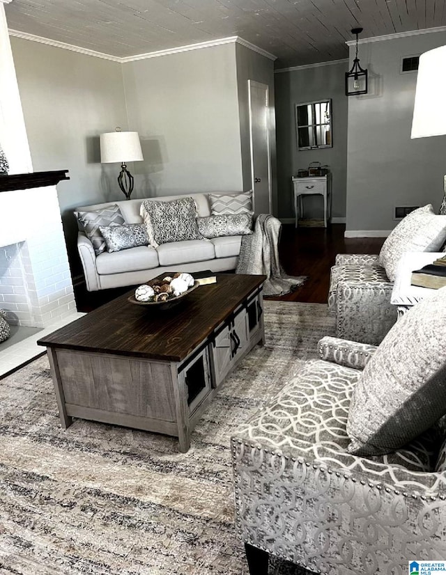 765 2nd Ave, Ashland, AL 36251 - living area with wood finished floors, crown molding, baseboards, and a fireplace