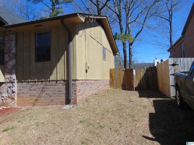 view of property exterior featuring fence