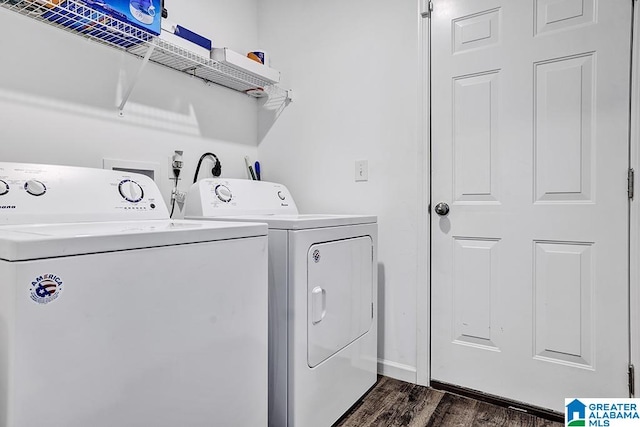 washroom featuring washer and clothes dryer and dark hardwood / wood-style floors