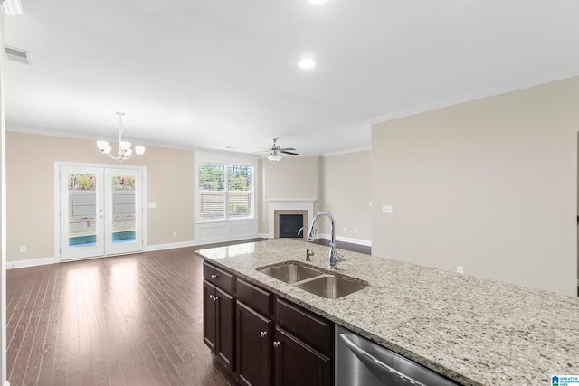 kitchen featuring ornamental molding, sink, hanging light fixtures, and dark hardwood / wood-style flooring