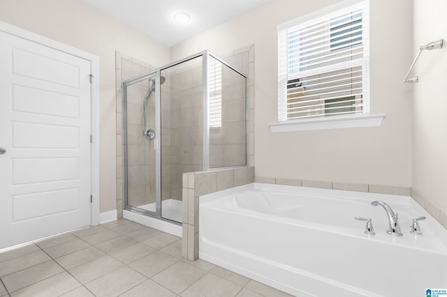 bathroom with tile patterned flooring and plus walk in shower