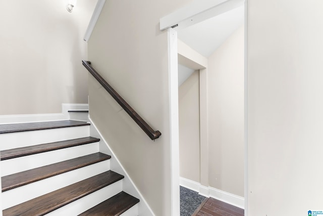 stairway featuring hardwood / wood-style floors