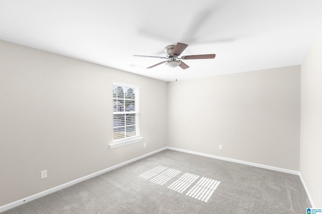 unfurnished room with carpet and ceiling fan