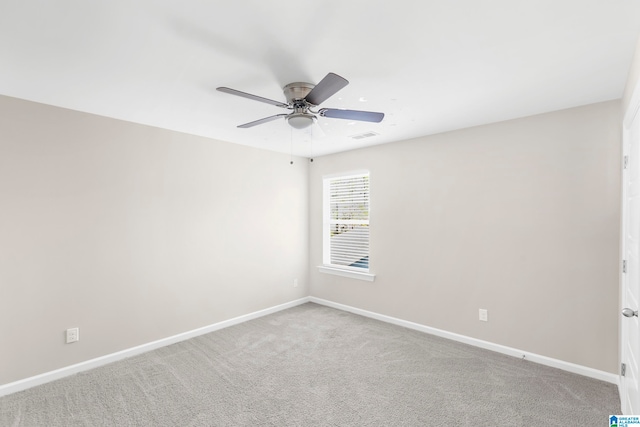 unfurnished room with light carpet and ceiling fan