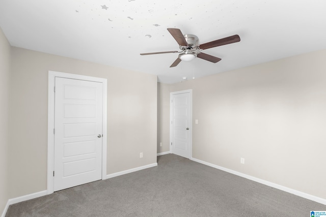 unfurnished room featuring carpet and ceiling fan