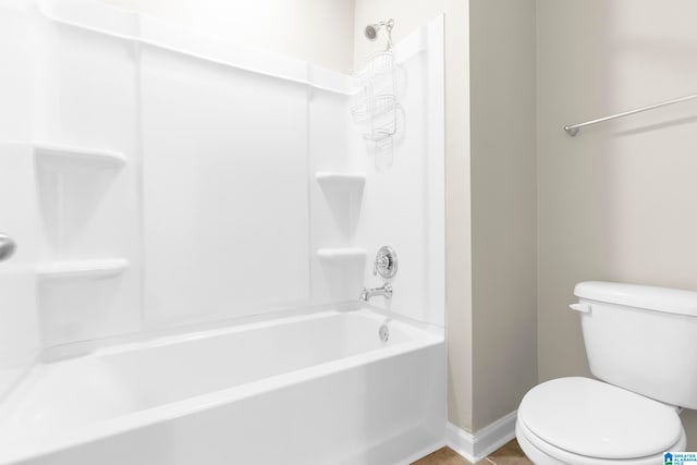 bathroom featuring  shower combination and toilet