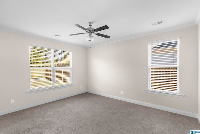 carpeted empty room with ornamental molding and ceiling fan