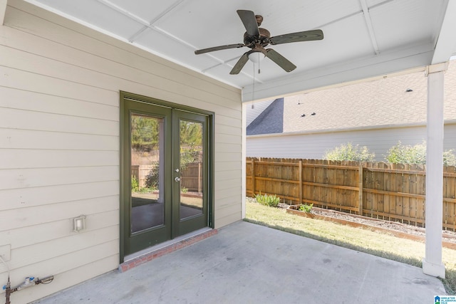 entrance to property featuring french doors, a patio, and ceiling fan