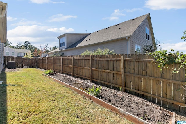 view of yard with central air condition unit