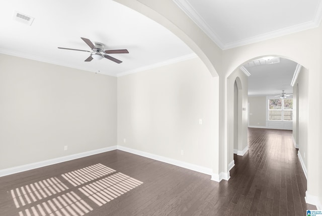 4092 Park Crossings Dr, Chelsea, AL 35043 - empty room with a ceiling fan, dark wood-style flooring, crown molding, baseboards, and arched walkways