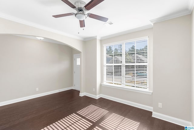 spare room with crown molding, dark hardwood / wood-style floors, and ceiling fan