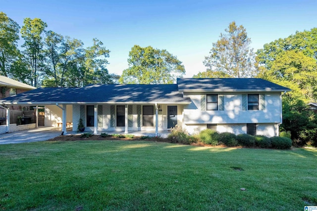 tri-level home with a front lawn