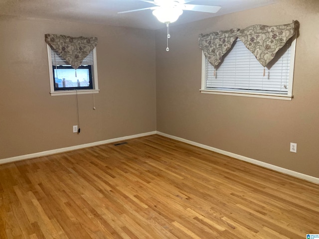 spare room featuring ceiling fan and light wood-type flooring