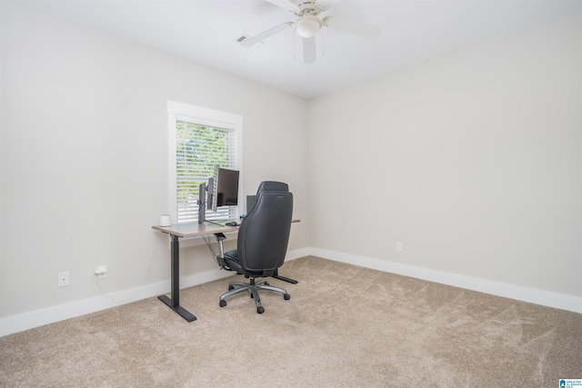 carpeted home office with ceiling fan