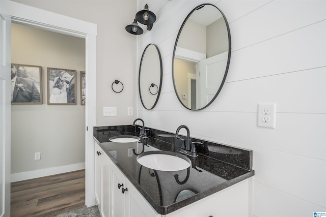 bathroom with vanity and hardwood / wood-style flooring