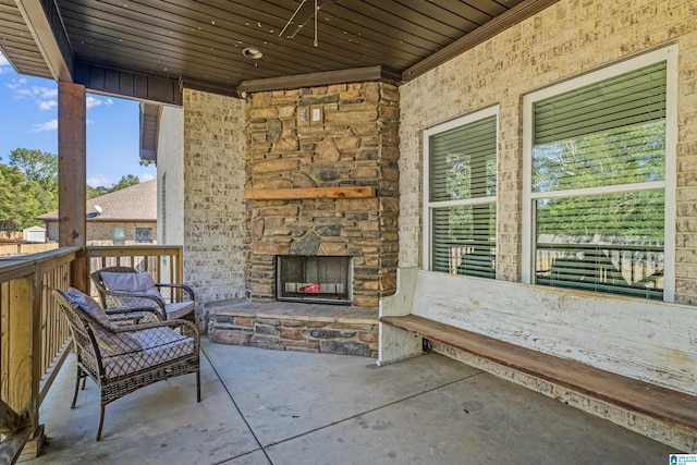 view of patio / terrace featuring an outdoor stone fireplace