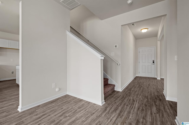 foyer entrance with dark wood-type flooring