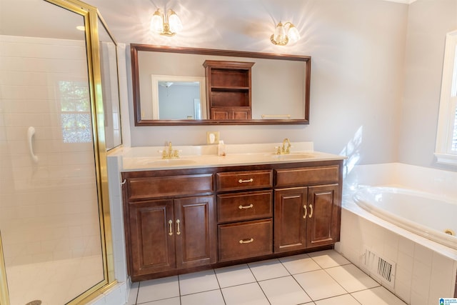 bathroom featuring vanity, tile patterned flooring, and plus walk in shower