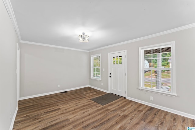 entryway with crown molding and dark hardwood / wood-style flooring