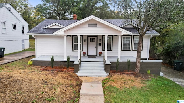 bungalow-style home with a porch