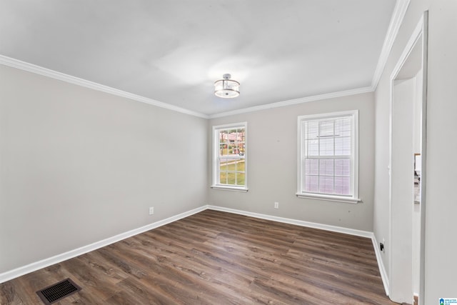 empty room with ornamental molding and dark wood-type flooring